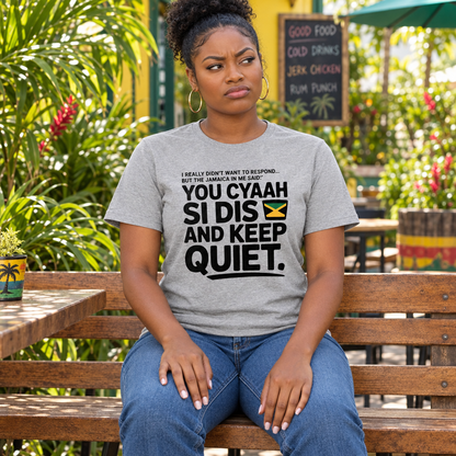 Seated female model wearing the grey Jamaica shirt with an annoyed expression